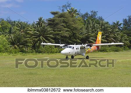 "Aircraft """"Twin Otter"""" of the AIR SEYCHELLES airline at the airport of Denis Island, Seychelles, Africa" View Large Photo Image Stock Image - "Aircraft """"Twin Otter"""" of the AIR SEYCHELLES airline at the airport of Denis Island, Seychelles, Africa". Fotosearch