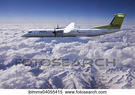 Stock Photography - Aircraft YL-BAJ Air Baltic De Havilland Dash 8 in flight above the Alps. Fotosearch