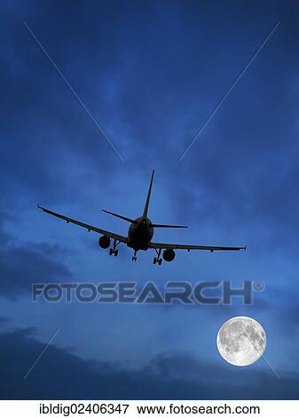 Airplane and moon in blue sky View Large Photo Image Stock Photo - Airplane and moon in blue sky. Fotosearch
