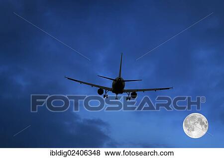 Airplane and moon in blue sky View Large Photo Image Stock Photo - Airplane and moon in blue sky. Fotosearch