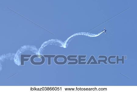 "Airplane swirling through the sky, Waukesha Air Show, Waukesha, Wisconsin, USA" View Large Photo Image Stock Image - "Airplane swirling through the sky, Waukesha Air Show, Waukesha, Wisconsin, USA". Fotosearch