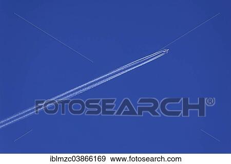 "Airplane with contrails in the blue sky, Bavaria, Germany, Europe" View Large Photo Image Stock Photo - "Airplane with contrails in the blue sky, Bavaria, Germany, Europe". Fotosearch