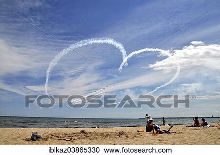 "Airplanes draw heart in the sky and fighter jets fly through it, Milwaukee Air Show, Bradford Beach, Milwaukee, Wisconsin, USA" View Large Photo Image Stock Image - "Airplanes draw heart in the sky and fighter jets fly through it, Milwaukee Air Show, Bradford Beach, Milwaukee, Wisconsin, USA". Fotosearch