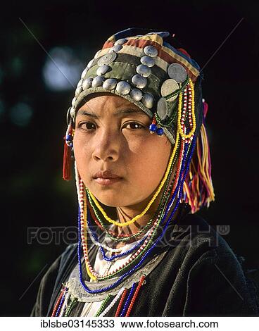 "Akha girl with traditional clothing and headdress, portrait, Chiang Rai Province, Northern Thailand, Thailand, Asia" View Large Photo Image Stock Image - "Akha girl with traditional clothing and headdress, portrait, Chiang Rai Province, Northern Thailand, Thailand, Asia". Fotosearch
