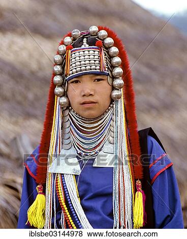 Stock Photo - "Akha girl with traditional clothing and headdress, portrait, Chiang Rai Province, Northern Thailand, Thailand, Asia". Fotosearch