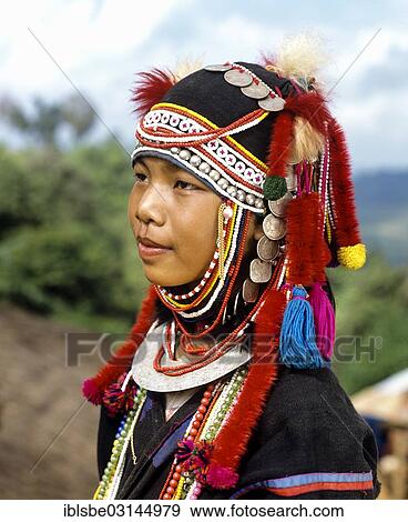"Akha girl with traditional clothing and headdress, portrait, Chiang Rai Province, Northern Thailand, Thailand, Asia" View Large Photo Image Stock Photo - "Akha girl with traditional clothing and headdress, portrait, Chiang Rai Province, Northern Thailand, Thailand, Asia". Fotosearch