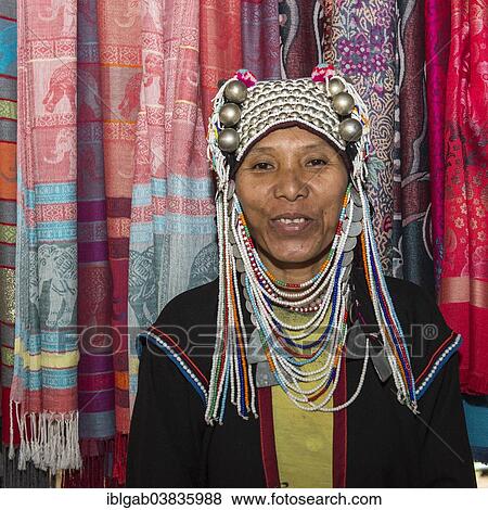 "Akha tribeswoman wearing traditional clothing with an ornate headdress, Chiang Mai, Thailand, Asia" View Large Photo Image Stock Photo - "Akha tribeswoman wearing traditional clothing with an ornate headdress, Chiang Mai, Thailand, Asia". Fotosearch