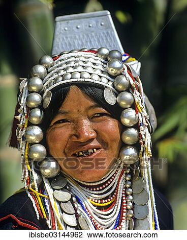 "Akha woman with traditional clothing and headdress with silver bells, portrait, Chiang Rai Province, Northern Thailand, Thailand, Asia" View Large Photo Image Stock Image - "Akha woman with traditional clothing and headdress with silver bells, portrait, Chiang Rai Province, Northern Thailand, Thailand, Asia". Fotosearch