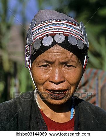 "Akha woman with traditional clothing and headdress with Silbergmuenzen, portrait, Chiang Rai Province, Northern Thailand, Thailand, Asia" View Large Photo Image Stock Photo - "Akha woman with traditional clothing and headdress with Silbergmuenzen, portrait, Chiang Rai Province, Northern Thailand, Thailand, Asia". Fotosearch