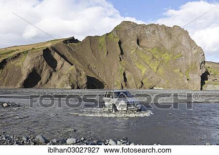 Stock Photo - "All-terrain vehicle crossing the glacial river of Krossa, Porsmork, Iceland, Europe". Fotosearch