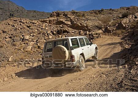 "All-terrain vehicle on a dirt slope, Wadi Bani Awf, Oman, Asia" View Large Photo Image Stock Image - "All-terrain vehicle on a dirt slope, Wadi Bani Awf, Oman, Asia". Fotosearch