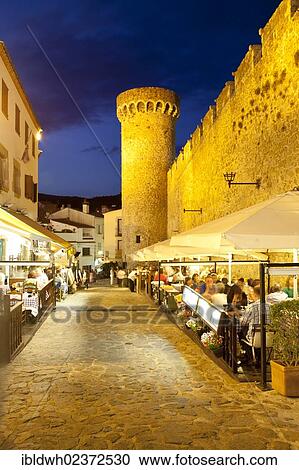 "Alley in the historic district of Vila Vella at night, Tossa de Mar, Costa Brava, Catalonia, Spain, Europe, PublicGround, Europe" View Large Photo Image Stock Image - "Alley in the historic district of Vila Vella at night, Tossa de Mar, Costa Brava, Catalonia, Spain, Europe, PublicGround, Europe". Fotosearch