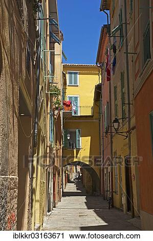 Stock Image - "Alley in the old town of Villefranche-sur-Mer, Villefranche-sur-Mer, French Riviera, Alpes-Maritimes, Provence-Alpes-Cote d? ÇÖAzur, France, Europe". Fotosearch