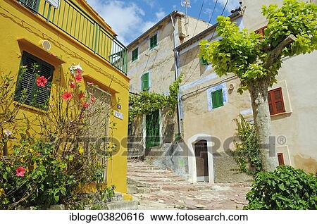 "Alley with houses in the village of Estellencs, also Estellenchs, Sierra de Tramuntana, Majorca, Balearic Islands, Spain, Europe" View Large Photo Image Stock Photograph - "Alley with houses in the village of Estellencs, also Estellenchs, Sierra de Tramuntana, Majorca, Balearic Islands, Spain, Europe". Fotosearch