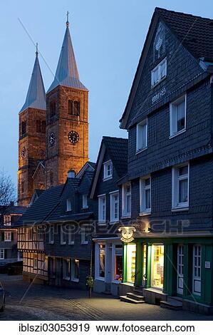 "Alleyway in the historic centre of Schwelm at dusk, illuminated Marienkirche church at back, Schwelm, North Rhine-Westphalia, Germany, Europe" View Large Photo Image Stock Photo - "Alleyway in the historic centre of Schwelm at dusk, illuminated Marienkirche church at back, Schwelm, North Rhine-Westphalia, Germany, Europe". Fotosearch
