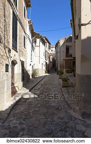 "Alleyway in the mountain village of Estellencs, Serra de Tramuntana, Northwestern Coast, Mallorca, Balearic Islands, Spain, Europe" View Large Photo Image Stock Image - "Alleyway in the mountain village of Estellencs, Serra de Tramuntana, Northwestern Coast, Mallorca, Balearic Islands, Spain, Europe". Fotosearch