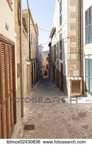 "Alleyway in the mountain village of Estellencs, Serra de Tramuntana, Northwestern Coast, Mallorca, Balearic Islands, Spain, Europe" View Large Photo Image Stock Photograph - "Alleyway in the mountain village of Estellencs, Serra de Tramuntana, Northwestern Coast, Mallorca, Balearic Islands, Spain, Europe". Fotosearch