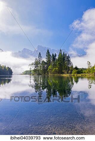 Stock Image - "Almsee lake with reflection, Elferkogel, Zwolferkogel, Totes Gebirge mountains, Grunau, Almtal, Salzkammergut, Austria, Europe". Fotosearch