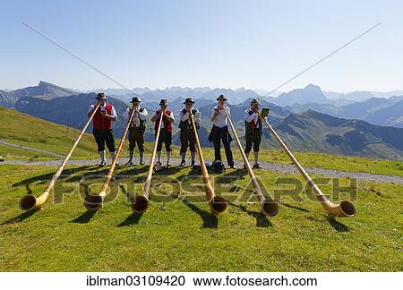 Stock Image - "Alphorn players, Diedamskopf, Schoppernau, Bregenzerwald, Bregenzer Wald, Vorarlberg, Austria, Europe". Fotosearch