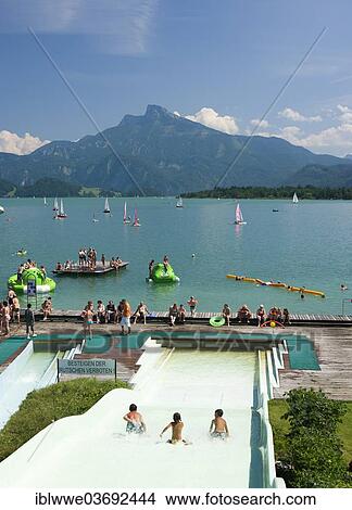 Picture - "Alpine lakeside pool, water slide, Schafberg Mountain, Mondsee lake, Salzkammergut, Austria, Europe". Fotosearch