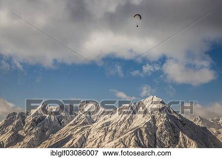 Stock Photo - "Alps with a paraglider, Parseierspitze and Rauer Kopf mountains from Venet mountain, Venet, Zams, Tyrol, Austria, Europe". Fotosearch