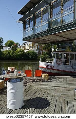 "Alster river steamer on Osterbekkanal canal, deck chairs on the Muehlenkamp pier, Hamburg, Hamburg, Germany, Europe" View Large Photo Image Stock Photo - "Alster river steamer on Osterbekkanal canal, deck chairs on the Muehlenkamp pier, Hamburg, Hamburg, Germany, Europe". Fotosearch