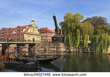 "Altes Kaufhaus, baroque facade from 1742, now a hotel, right Alter Kran cran, barges on Ilmenau river, Am Stint, Luneburg, Lower Saxony, Germany, Europe" View Large Photo Image Stock Photo - "Altes Kaufhaus, baroque facade from 1742, now a hotel, right Alter Kran cran, barges on Ilmenau river, Am Stint, Luneburg, Lower Saxony, Germany, Europe". Fotosearch