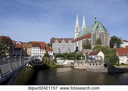 Altstadtbruecke bridge across the Neisse river between Goerlitz, Saxony, Germany and Zgorzelec, Poland, Church of St. Peter and Paul, Waidhaus building and Vierradenmuehle mill, Poland, Europe View Large Photo Image Stock Photo - Altstadtbruecke bridge across the Neisse river between Goerlitz, Saxony, Germany and Zgorzelec, Poland, Church of St. Peter and Paul, Waidhaus building and Vierradenmuehle mill, Poland, Europe. Fotosearch