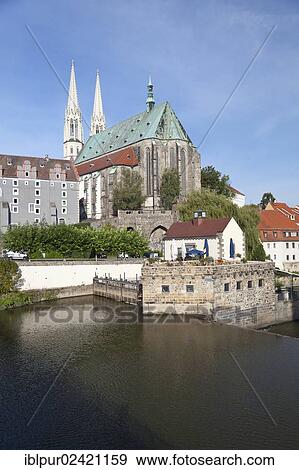 Altstadtbruecke bridge across the Neisse river between Goerlitz, Saxony, Germany and Zgorzelec, Poland, Church of St. Peter and Paul, Waidhaus building and Vierradenmuehle mill, Poland, Europe View Large Photo Image Stock Photo - Altstadtbruecke bridge across the Neisse river between Goerlitz, Saxony, Germany and Zgorzelec, Poland, Church of St. Peter and Paul, Waidhaus building and Vierradenmuehle mill, Poland, Europe. Fotosearch
