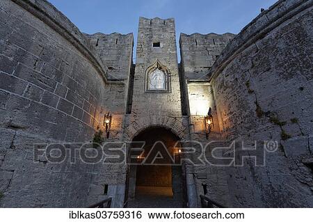 Stock Photograph - "Amboise Gate, medieval bastion, blue hour, historic town centre, Rhodes, Island of Rhodes, Dodecanese, Greece, Europe". Fotosearch