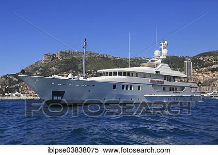 Stock Photography - Amels Holland motor yacht Marjorie Morningstar at anchor in front of the Principality of Monaco. Fotosearch
