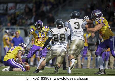 Stock Photo - "American football, Kicker Sebastian Daum, No. 18 Vikings, kicks a PAT, Vienna Vikings vs. Prague Panthers, Vienna, Vienna State, Austria, Europe". Fotosearch