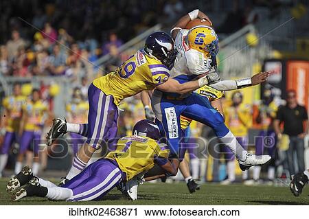 "American football, QB Chris Gunn, No. 12 Giants, is tackled by LB Simon Blach, No. 49 Vikings, Graz Giants vs. Vienna Vikings, Vienna, Vienna State, Austria, Europe" View Large Photo Image Stock Image - "American football, QB Chris Gunn, No. 12 Giants, is tackled by LB Simon Blach, No. 49 Vikings, Graz Giants vs. Vienna Vikings, Vienna, Vienna State, Austria, Europe". Fotosearch