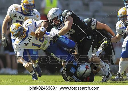 "American football, QB Chris Gunn, No. 12 Giants, is tackled DL Bene Brugnara, No. 90 Raiders, Swarco Raiders Tirol vs. Graz Giants, Innsbruck, Tyrol, Austria, Europe" View Large Photo Image Stock Photo - "American football, QB Chris Gunn, No. 12 Giants, is tackled DL Bene Brugnara, No. 90 Raiders, Swarco Raiders Tirol vs. Graz Giants, Innsbruck, Tyrol, Austria, Europe". Fotosearch