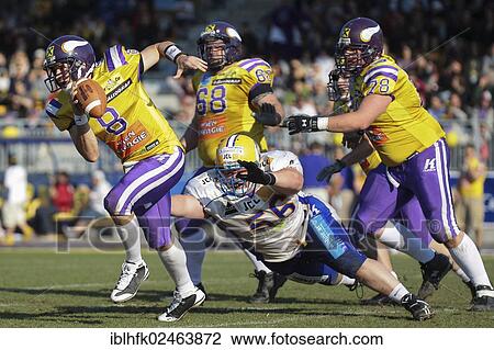 Stock Image - "American football, QB Christoph Gross, No. 8 Vikings, runs with the ball, Graz Giants vs. Vienna Vikings, Vienna, Vienna State, Austria, Europe". Fotosearch