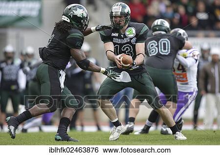 "American football, QB Thomas Haider, No. 13 Dragons, hands the ball to RB Tunde Ogun, No. 1 Dragons, Danube Dragons vs. Vienna Vikings, Vienna, Vienna State, Austria, Europe" View Large Photo Image Stock Photograph - "American football, QB Thomas Haider, No. 13 Dragons, hands the ball to RB Tunde Ogun, No. 1 Dragons, Danube Dragons vs. Vienna Vikings, Vienna, Vienna State, Austria, Europe". Fotosearch