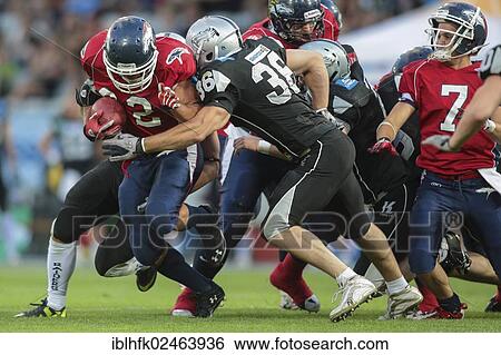 "American football, RB DJ Wolfe, No. 32 Broncos, is tackled by LB Philipp Margreiter, No. 36 Raiders, Swarco Raiders Tirol vs. Calanda Broncos, Innsbruck, Tyrol, Austria, Europe" View Large Photo Image Stock Photograph - "American football, RB DJ Wolfe, No. 32 Broncos, is tackled by LB Philipp Margreiter, No. 36 Raiders, Swarco Raiders Tirol vs. Calanda Broncos, Innsbruck, Tyrol, Austria, Europe". Fotosearch