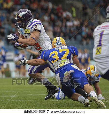 "American football, RB Dusty Thornhill, No. 2 Vikings, is tackled by LB Alex Gross, No. 37 Giants, Vienna Vikings vs. Graz Giants, Graz, Austria, Europe" View Large Photo Image Stock Photo - "American football, RB Dusty Thornhill, No. 2 Vikings, is tackled by LB Alex Gross, No. 37 Giants, Vienna Vikings vs. Graz Giants, Graz, Austria, Europe". Fotosearch