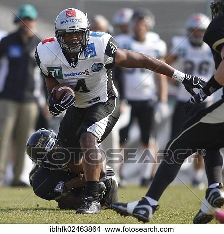 "American football, WR Talib Wise, No. 4 Raiders, is tackled, Kornmesser Rangers vs. Swarco Raiders Tirol, Vienna, Vienna State, Austria, Europe" View Large Photo Image Picture - "American football, WR Talib Wise, No. 4 Raiders, is tackled, Kornmesser Rangers vs. Swarco Raiders Tirol, Vienna, Vienna State, Austria, Europe". Fotosearch