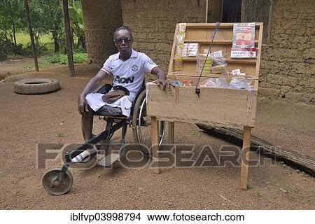 "Amputee sitting in for his mobile shop, Motema Amputee Camp, Koidu, Koidu-Sefadu, Kono District, Eastern Province, Sierra Leone, Africa" View Large Photo Image Picture - "Amputee sitting in for his mobile shop, Motema Amputee Camp, Koidu, Koidu-Sefadu, Kono District, Eastern Province, Sierra Leone, Africa". Fotosearch