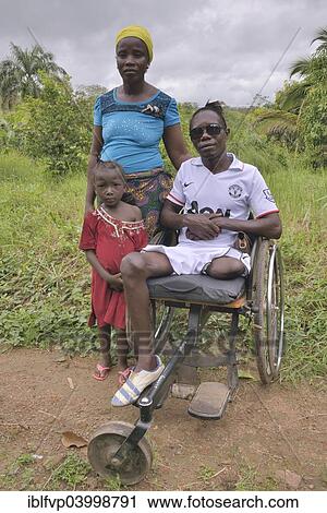 "Amputee with his wife and child, Motema Amputee Camp, Koidu, Koidu-Sefadu, Kono District, Eastern Province, Sierra Leone, Africa" View Large Photo Image Stock Image - "Amputee with his wife and child, Motema Amputee Camp, Koidu, Koidu-Sefadu, Kono District, Eastern Province, Sierra Leone, Africa". Fotosearch