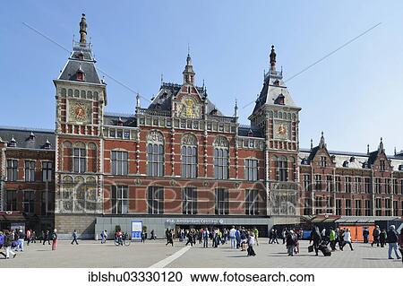 Stock Image - "Amsterdam Centraal railway station, Amsterdam, province of North Holland, The Netherlands, Europe". Fotosearch