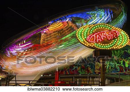"Amusement ride, light trails at night, Kassel, Hesse, Germany, Europe" View Large Photo Image Stock Image - "Amusement ride, light trails at night, Kassel, Hesse, Germany, Europe". Fotosearch
