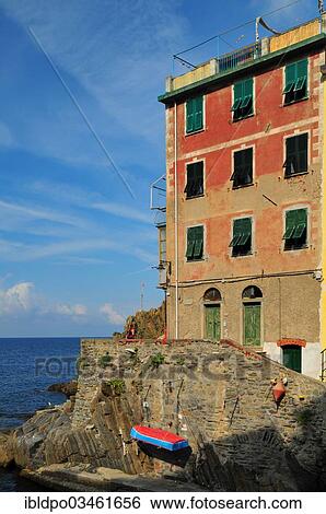 "An aged house built right at the edge of the sea, Riomaggiore, Cinque Terre, Liguria, Italy, Europe" View Large Photo Image Stock Photograph - "An aged house built right at the edge of the sea, Riomaggiore, Cinque Terre, Liguria, Italy, Europe". Fotosearch