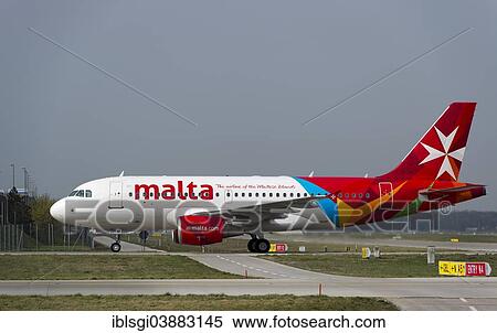 "An Airbus A319-112 of the airline AIR MALTA rolls to its parking position at Munich Airport, Munich, Upper Bavaria, Bavaria, Germany, Europe" View Large Photo Image Stock Photography - "An Airbus A319-112 of the airline AIR MALTA rolls to its parking position at Munich Airport, Munich, Upper Bavaria, Bavaria, Germany, Europe". Fotosearch