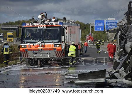 Stock Photo - "An airport fire engine helping to extinguish at a truck fire on the A8 motorway near the """"Echterdinger Ei"""" junction, Stuttgart, Baden-Wuerttemberg, Germany, Europe". Fotosearch