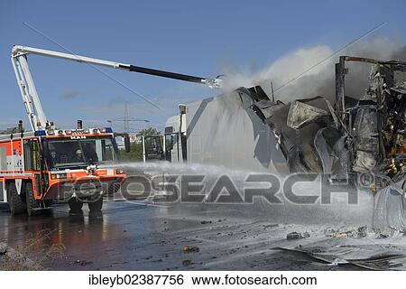 Stock Photograph - "An airport fire engine is helping to extinguish at a truck fire on the A8 motorway near the """"Echterdinger Ei"""" junction, Stuttgart, Baden-Wuerttemberg, Germany, Europe". Fotosearch