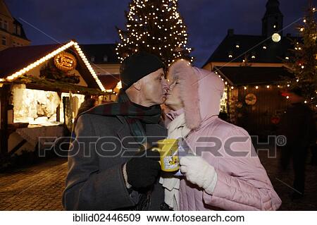 "An elderly couple kissing at the Christmas market in Annaberg-Buchholz, Saxony, Germany, Europe" View Large Photo Image Stock Photo - "An elderly couple kissing at the Christmas market in Annaberg-Buchholz, Saxony, Germany, Europe". Fotosearch