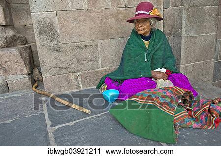 "An elderly woman in traditional dress of the Quechua Indians sitting on the floor in front of an Inca wall, Cusco Province, Peru, South America" View Large Photo Image Stock Image - "An elderly woman in traditional dress of the Quechua Indians sitting on the floor in front of an Inca wall, Cusco Province, Peru, South America". Fotosearch
