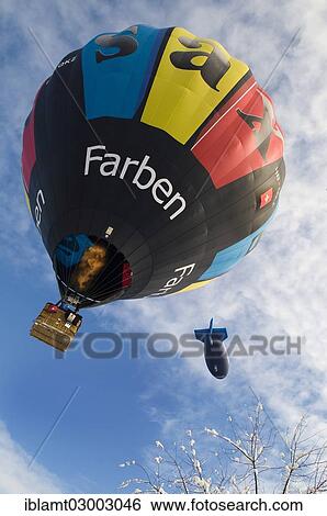 "An hot-air balloon and an airship, 12th Tegernseer Tal Montgolfiade, Bad Wiessee, Bavaria, Germany, Europe, Bad Wiessee, Germany, Europe" View Large Photo Image Stock Photograph - "An hot-air balloon and an airship, 12th Tegernseer Tal Montgolfiade, Bad Wiessee, Bavaria, Germany, Europe, Bad Wiessee, Germany, Europe". Fotosearch